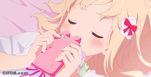 Girl Laying On Bed Looking At Phone GIF