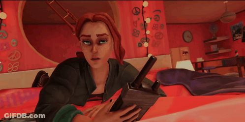 Girl Laying On Bed Looking At Tablet GIF