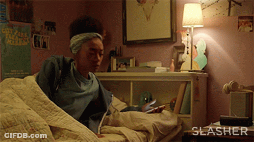 Girl Laying On Bed With City Fall Marathon Poster GIF