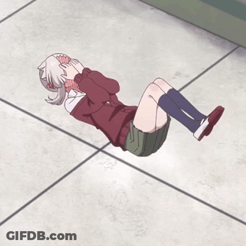 Girl Laying On Floor With Legs Crossed And Head Down GIF
