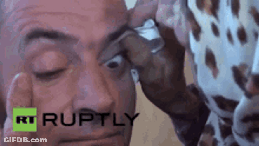 Girl Licking The Eyeball Of A Guy GIF