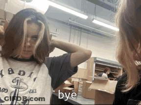 Girl Looking At Mirror Saying Bye GIF