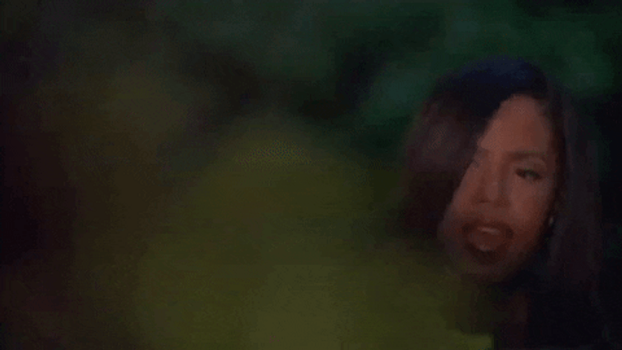 Girl Looking From The Bushes GIF