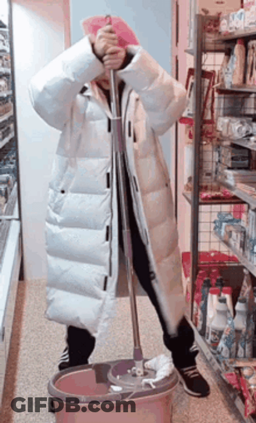 Girl Looking Unaccustomed To Cleaning GIF