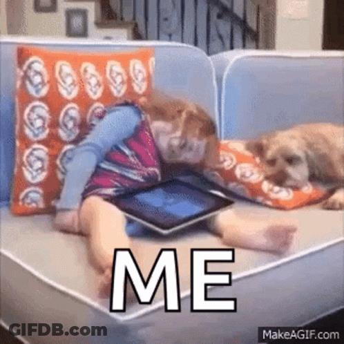 Girl Lying On Couch With Dog Using Tablet GIF