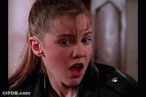 Girl Making Funny Face In Leather Jacket GIF