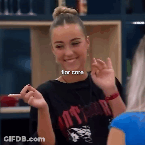 Girl Making Funny Face Pointing At Camera In Black Flor Core Shirt GIF