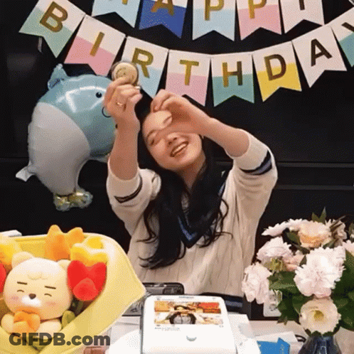 Girl Making Heart Hands Before Birthday Banner GIF