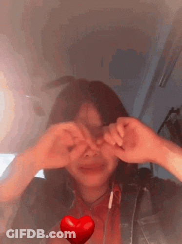Girl Making Heart Shape With Hands GIF