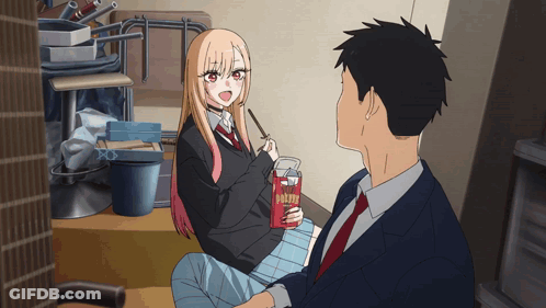 Girl Next To Man Holding Box Of Pocky Sticks GIF