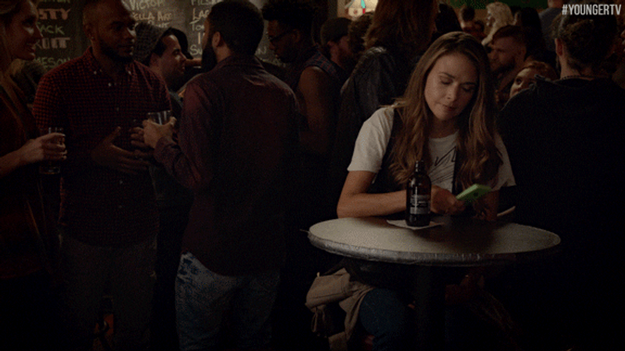 Girl On Bar Being Left On Read GIF