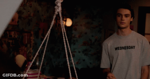 Girl On Couch Next To Marvel Poster GIF