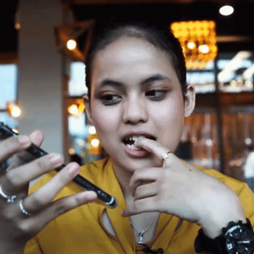 Girl On Phone Nail Biter GIF