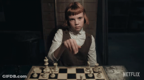 Girl Playing Chess With Netflix Logo GIF