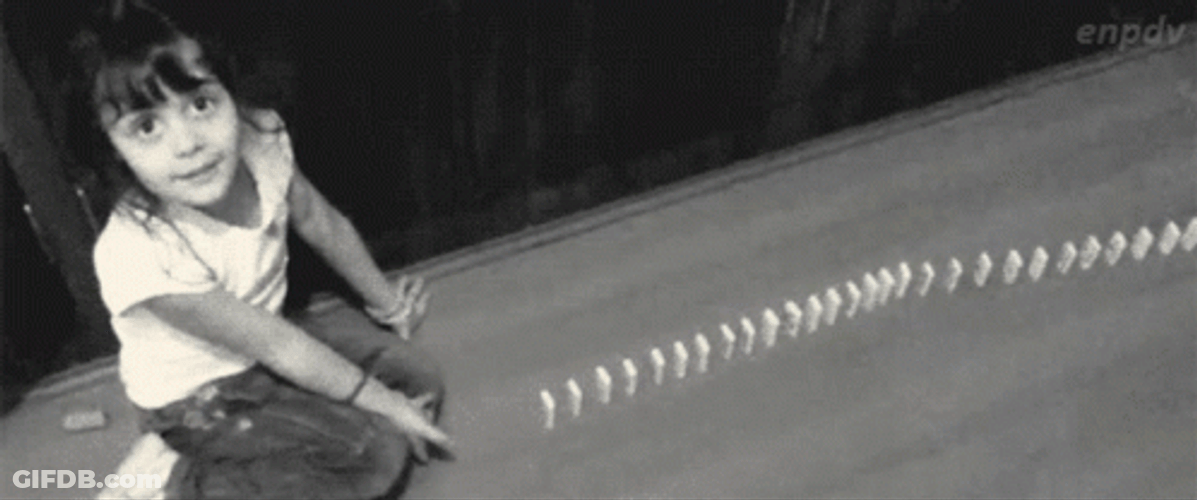 Girl Playing Dominos Falling GIF