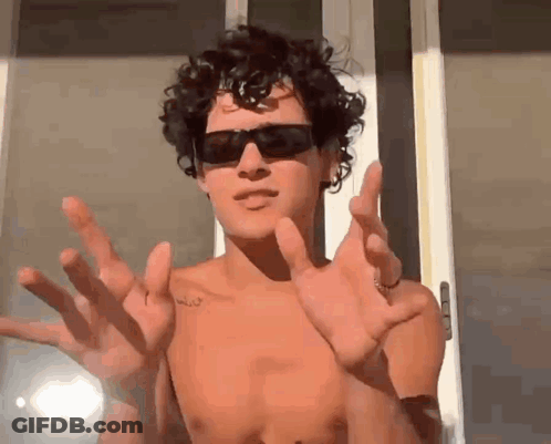 Girl Pointing At Boy's Face GIF