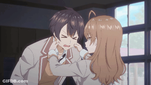 Girl Putting Fingers In Boy's Ear GIF