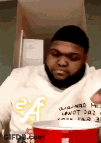 Girl Putting Hand On Boy's Forehead GIF