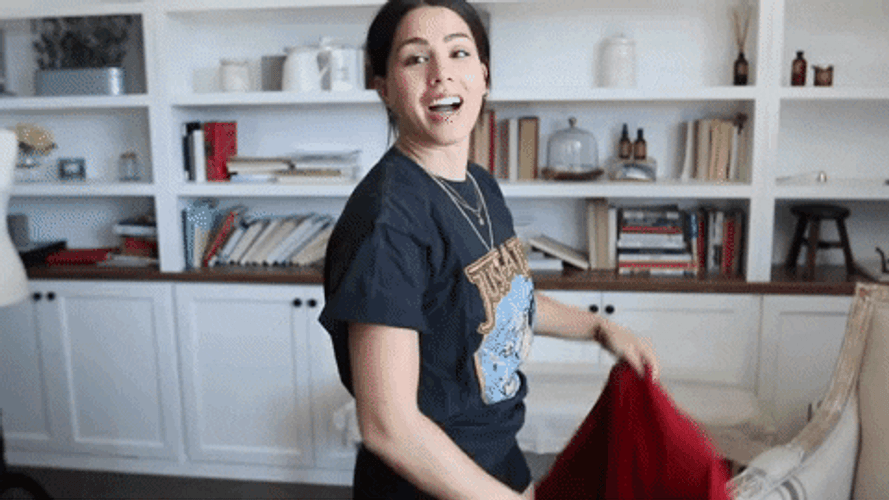 Girl Raising Red Cloth And Disappear GIF