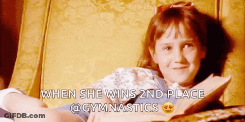 Girl Reading Book After Gymnastics Win GIF