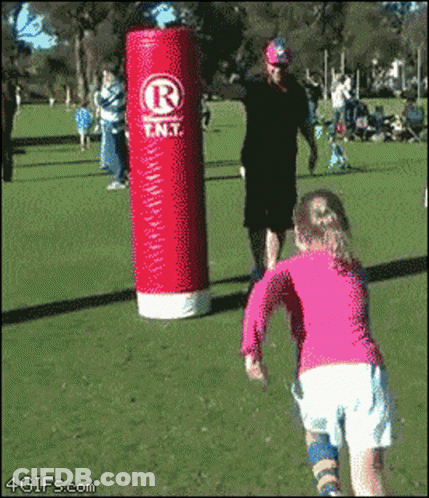 Girl Running Toward Red Punching Bag Saying Rent GIF