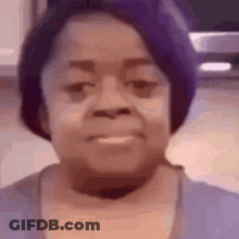 Girl's Face Close Up With T.I. Sign GIF