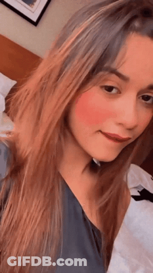 Girl Saying Mmm While Holding Chin GIF