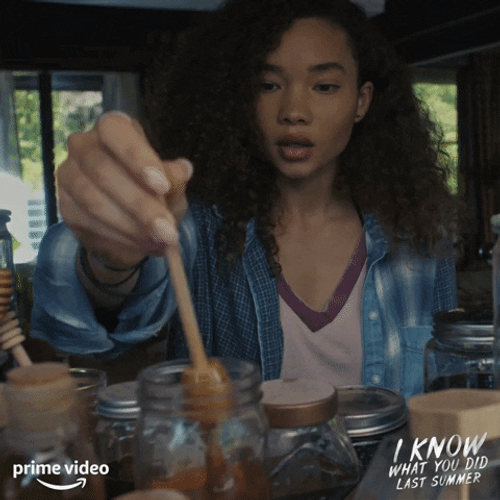 Girl Scooping Honey From The Jar GIF