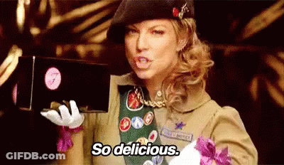 Girl Scout Holding Chocolates Saying So Delicious GIF