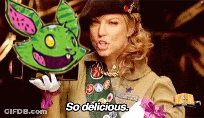 Girl Scout Holding Green Bunny Saying So Delicious GIF
