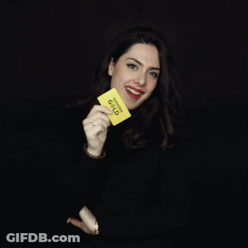 Girl Showing A Gold VIP Card GIF
