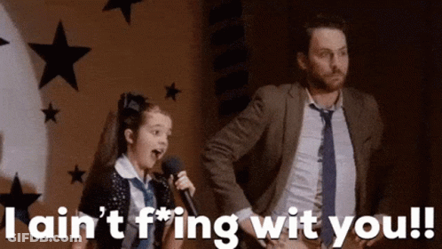 Girl Singing Into Microphone Beside Man In Suit GIF
