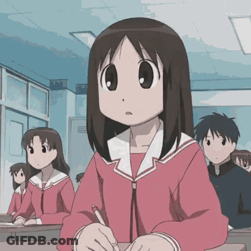 Girl Sitting At Desk In Classroom GIF