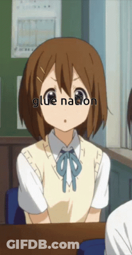 Girl Sitting At Desk With Glue Nation On Face GIF