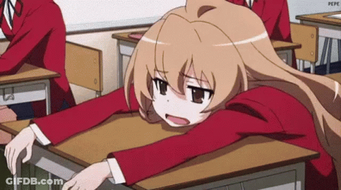 Girl Sitting At Desk With Head On Desk GIF