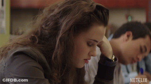 Girl Sitting At Desk With Netflix Logo GIF