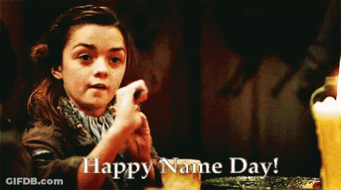 Girl Sitting At Table Saying Happy Name Day GIF