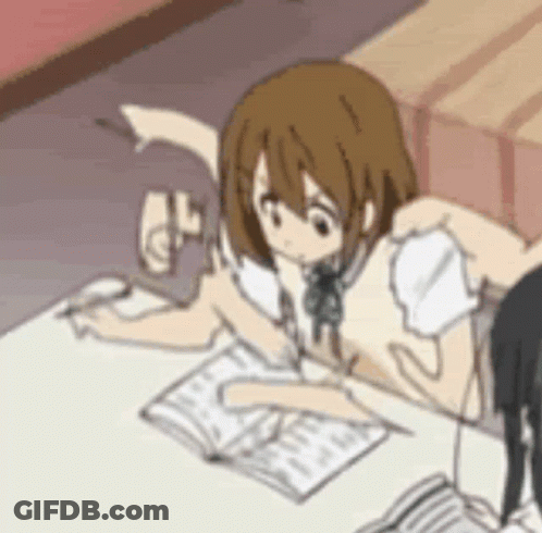 Girl Sitting At Table With Book And Pencil GIF
