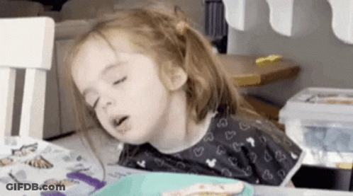 Girl Sitting At Table With Food GIF