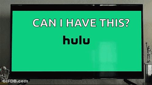 Girl Sitting At Table With Hulu Logo And Food GIF