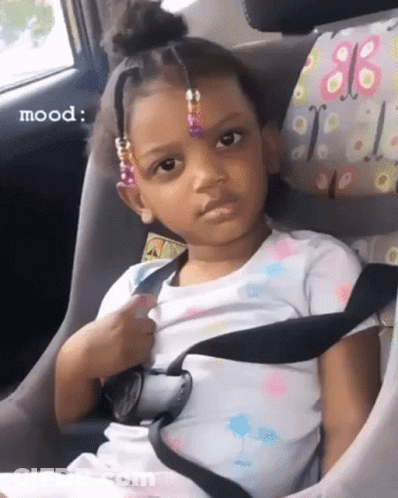 Girl Sitting In Car Seat Making Funny Face GIF