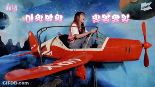 Girl Sitting In Red Airplane With T & R GIF