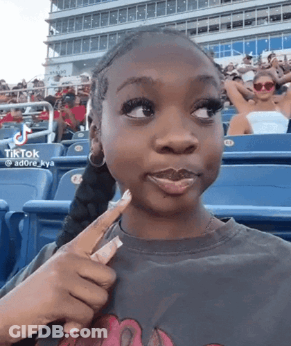 Girl Sitting In Stadium With TikTok GIF