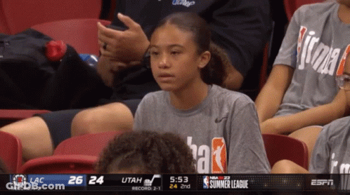 Girl Sitting In Stands At Basketball Game GIF