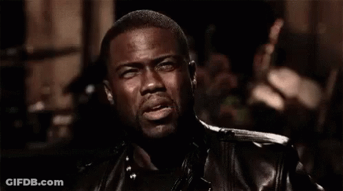 Girl Sitting On Bed Surrounded By People GIF