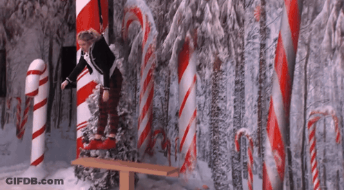 Girl Sitting On Bench In Candy Cane Forest GIF