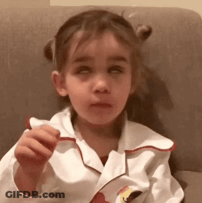 Girl Sitting On Couch Eating Candy GIF