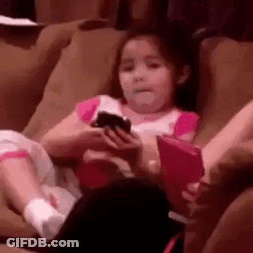 Girl Sitting On Couch Holding Phone GIF