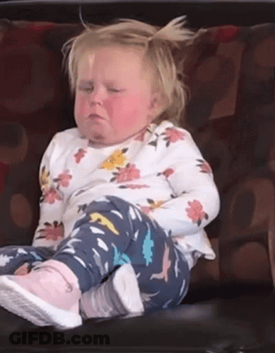 Girl Sitting On Couch With Eyes Closed GIF