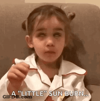 Girl Sitting On Couch With Sunburn GIF